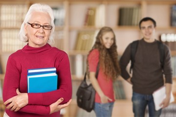 Mature female student with books smiling