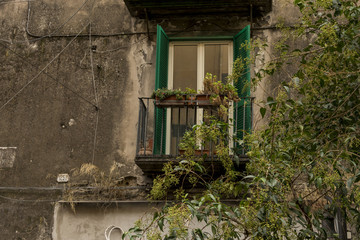Window in old building on the streets of Naples old town Italy
