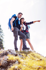 Couple with backpack on hiking trip