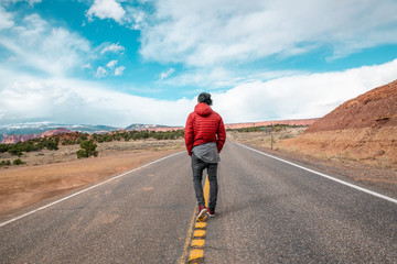 Obraz premium Man walking on road in Utah