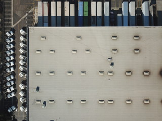 Aerial Photos of Warehouse with trailers and trucks negative space
