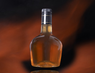 liquor bottle on black background with fire