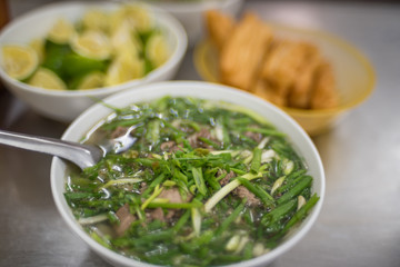 Pho soup with plenty on spring onions