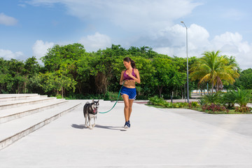 Mexican woman trainning with her dog
