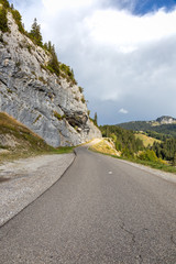Fototapeta premium Mountain road in France near Annecy on an overcast day before the rain