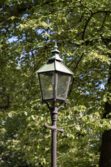 Fototapeta na wymiar Street lamp on the sidewalk by Turku Cathedral in Turku, Finland.