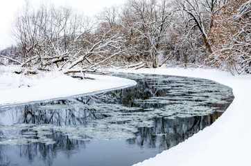 Ice Forming on the River Bend in Winter