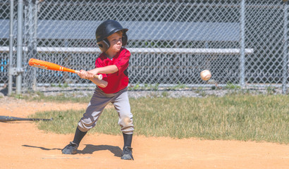 Baseball Player Swinging at Ball © J. Novack