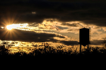 sun rays over the water tower