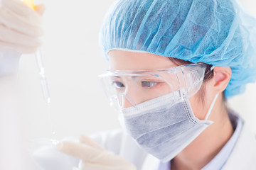 Fototapeta premium scientist take microscope slide