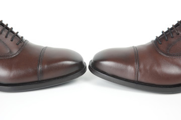 Classic men's brown Oxford shoes on white background. Leather shoes