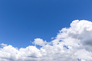 Blue sky background with white clouds, rain clouds.