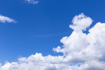 Naklejka na ściany i meble Blue sky background with white clouds, rain clouds.