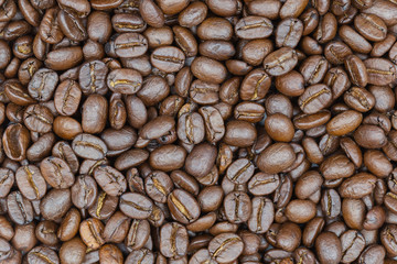 Roasted brown coffee beans background.