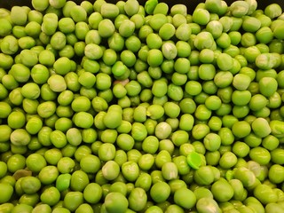 Top view of green peas as a background, healthy food concept