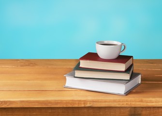 Cup of hot coffee with beans on