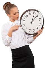 Portrait of young businesswoman in suit holding big clock