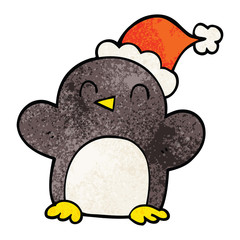 cartoon doodle penguin wearing christmas hat