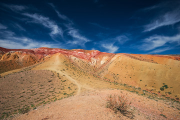Woman with her son in valley of Mars landscapes in the Altai Mountains, Kyzyl Chin, Siberia, Russia