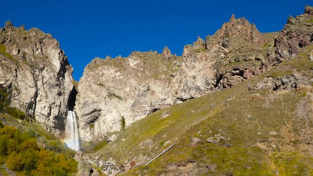 Beautifull landscape view of a big waterfall at Caucasus mountains near mount Elbrus - the highest peak in Europe.