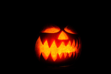 Spooky halloween pumpkin on a black background