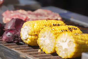 Grilled corn on the grill. Cooking food on the street
