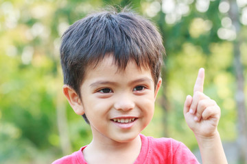 Portrait of smiling little young Asian boy