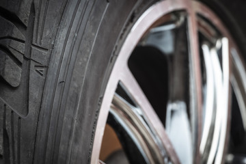 Chrome modern car wheel close-up after washing.