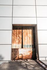Rusty door and modern building