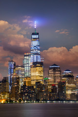 Manhattan midtown skyline at twilight over Hudson river , New York City