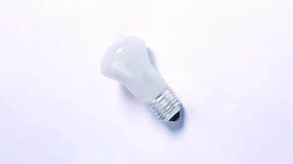 finger touching the bulb. isolated on a white background. photo with copy space