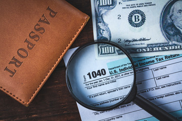 Payment of taxes. Filling by the taxpayer of the tax form 1040. Tax return, passport, american...