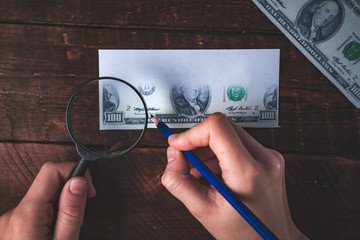 Fake money. Counterfeiter forges banknotes. Fake concept.