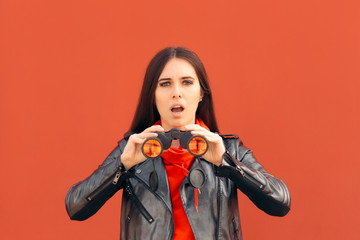 Visionary Millennial Girl Looking through Binoculars 