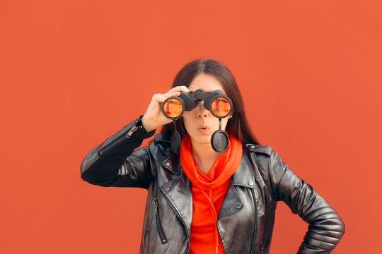 Visionary Millennial Girl Looking through Binoculars 