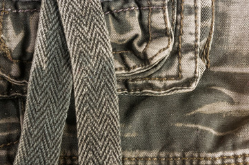 clothing items washed cotton fabric texture with seams, clasps, buttons and rivets
