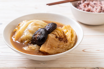 boiled cabbage in red soup with mushroom