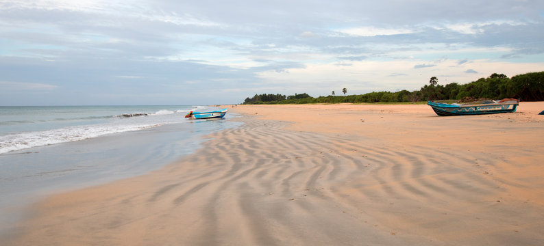 Beached boat on Nilaveli beach in Trincomalee Sri Lanka Asia