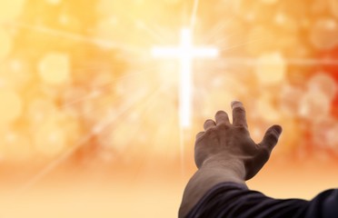 Male hand with cross of lights