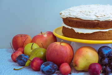 Rustic pumpkin spice cake layers on tabletop display with autumn fruit