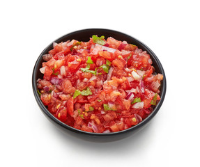 Tomato salsa dip top view isolated on white background