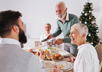 Family gathered over for Christmas holidays, celebrating, having lunch 