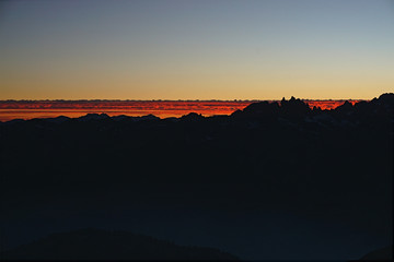 Fiery Sunset From The Peak Of A Mountain