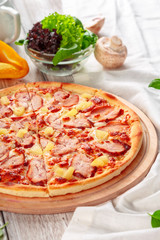 Delicious fresh pizza served on wooden table