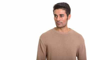 Young handsome Persian man against white background