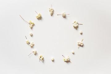 White balls on a white background. Christmas composition, flat, top view