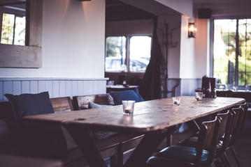 Cozy restaurant table in rustic wood, british style cafe