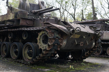 Fototapeta na wymiar old military equipment destroyed in battles and wars. Tanks as a murder weapon.