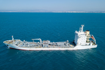 Top down aerial image of a large Cement carrier ship at sea