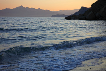 Fototapeta na wymiar View to evening Black sea with mountains on background